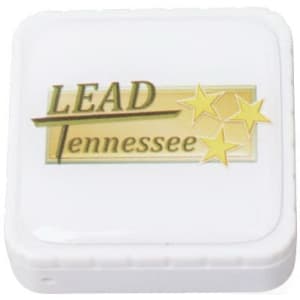 A square white flash drive with a logo on the front featuring the word "LEAD" and stars.