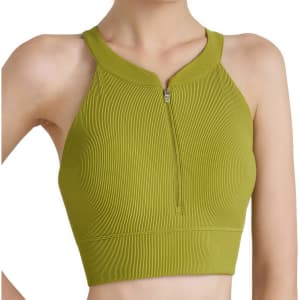A green zip-front racerback yoga crop bra tank featuring a ribbed texture and a fitted design. It includes a logo.
