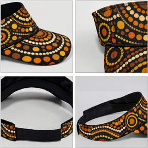 A full sublimation visor featuring a colourful circular pattern in orange, brown, and cream with a black inner band.