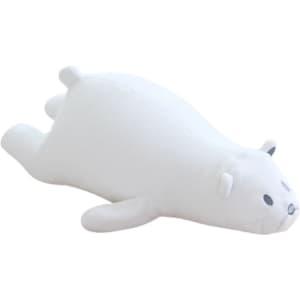 A white bear-shaped travel pillow with small ears and a simple face design, featuring a soft, plush surface.