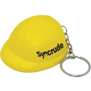 A yellow helmet-shaped stress reliever attached to a keyring, featuring a logo.