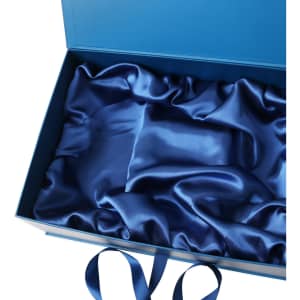 A custom gift box in blue, featuring a satin interior lining and decorative ribbon.