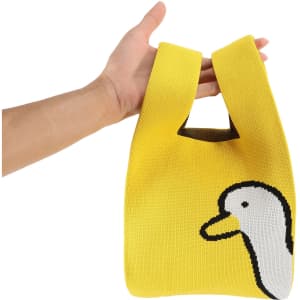 A yellow knitted handbag featuring a white duck design and a unique handle style. It has a logo on the side.