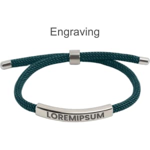 A metal woven bracelet with a teal cord and a silver engraving plate. It features a logo on the plate.