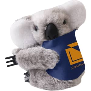A grey koala plush toy with large ears, featuring a blue and yellow logo on its belly.