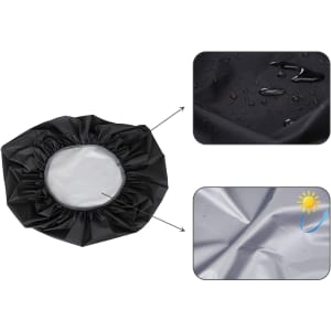 A black reflective backpack rain cover with a circular opening, featuring water droplets and a shiny surface.