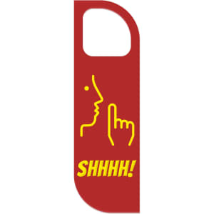 A red custom shape PVC door hanger featuring a yellow graphic of a finger to the lips, indicating silence.