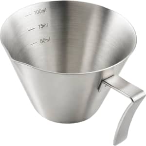 A stainless steel espresso measuring cup with measurement indicators for 50ml, 75ml, and 100ml. Features a handle.