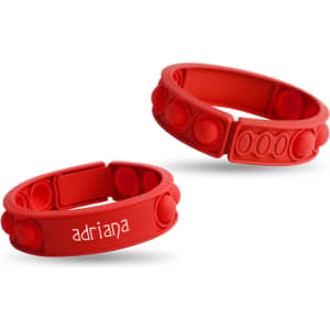Two red silicone wristbands with textured bubble sections, one featuring a logo and the other plain.