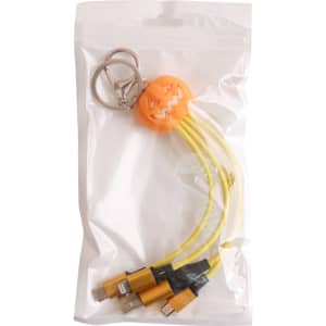 A yellow light-up charging cable with a keyring featuring a pumpkin-shaped design, packaged in a clear bag.