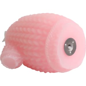 A pink sweater-shaped candle with a textured design and a metal base.