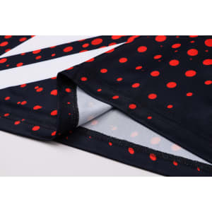 A unisex football jersey featuring a navy background with red dots and white stripes, showcasing a logo on the fabric.