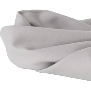 A quick-dry towel in a soft grey colour, featuring a smooth, folded edge, with a logo present.