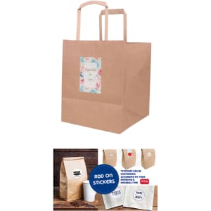 A flat handle kraft paper bag in brown, featuring a decorative label and sturdy handles.
