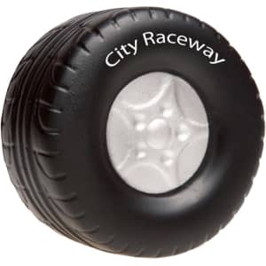 A black tire-shaped stress reliever featuring a silver wheel, with a logo on the side.