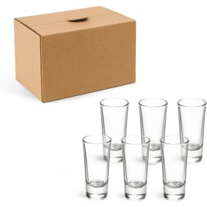 A cardboard box containing six clear glass shot glasses, each with a sleek design.