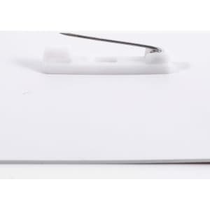 A white PVC name badge with a safety pin attachment on the back.