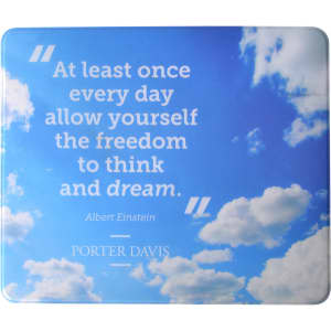 A mouse mat featuring a blue sky design with clouds and a quote attributed to Albert Einstein. It includes a logo.