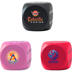 A set of three dice-shaped stress relievers in black, pink, and red, each featuring a logo.
