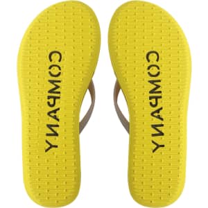 Bright yellow EVA platform thongs with a textured sole and a branding logo on the insole.