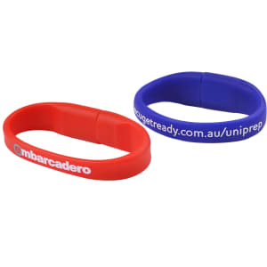 Two oval silicone wristbands in red and blue, each featuring a logo and text.