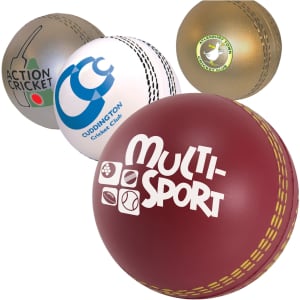 A collection of cricket ball-shaped stress relievers in various colours, featuring different logos and designs.