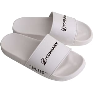 White PVC slides with a wide strap, featuring branding and a minimalist design.