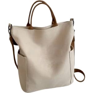 A vintage style canvas bag in cream with brown straps and pockets on the sides. It has a logo on one side.
