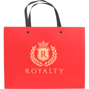 A red laminated handle bag with black handles, featuring a logo on the front and a decorative design.