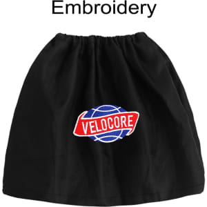 A black boot cover with a round logo featuring red and blue elements, and an embroidered text design.