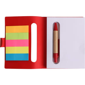 A red sticky notes holder featuring colourful sticky notes and a pen, with a cut-out for easy access.
