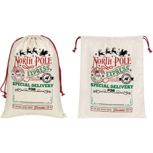 Two cream flax linen drawstring bags with festive designs and red drawstrings, featuring a logo.