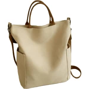 A vintage style canvas bag in cream with brown straps and pockets on the sides, featuring a logo.
