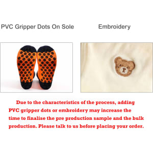 A pair of knee-high football socks featuring an orange towel bottom with black gripper dots and an embroidered design.
