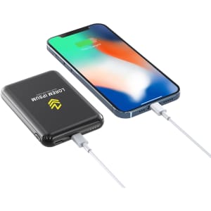 A black 5000mAh eco magnetic power bank connected to a smartphone via a cable, with a logo visible on the power bank.