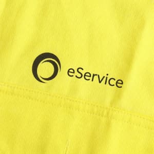 A bright yellow unisex long-sleeve reflective work shirt featuring a logo on the front.
