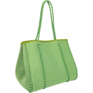 A large, green neoprene beach tote bag with braided handles and perforated detailing. It features a logo.