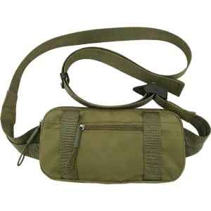A green travel fanny pack with a zippered compartment and adjustable strap. It features a logo on the front.