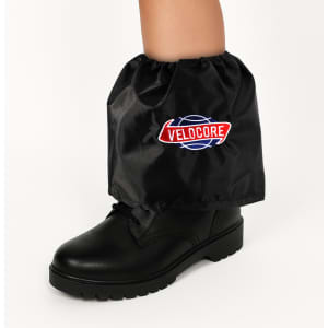 Waterproof black boot covers with an elastic top, fitting over a black boot, featuring a logo.