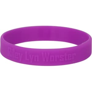 A purple embossed wristband featuring a logo, designed for exhibitions and events.