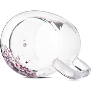 A clear glass mug featuring a double wall design with red and silver glitter inside, and a handle.