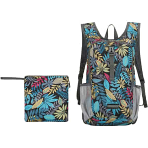 A large packable backpack in a multicoloured leaf pattern, with a smaller matching pouch beside it.