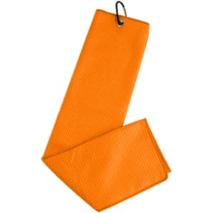 An orange waffle golf towel with a loop for hanging. The fabric has a textured pattern.