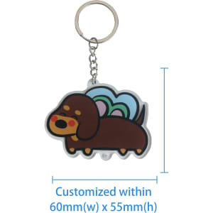 A custom-shaped acrylic keyring featuring a cartoon dog design in brown with colourful wings. It has a metal keyring attachment.