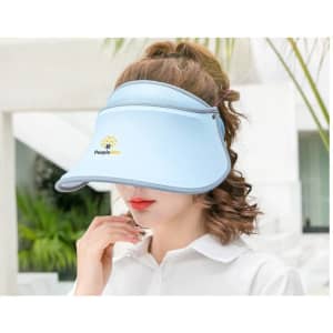 A light blue 360° swivel sun visor hat worn by a woman, featuring a logo on the front.