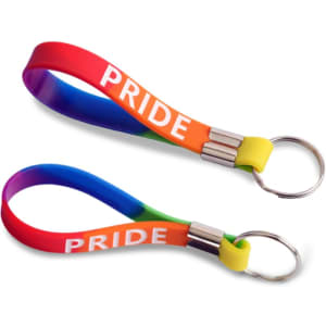 A silicone key ring in a rainbow design with a metal keyring attachment. It features the word "PRIDE."