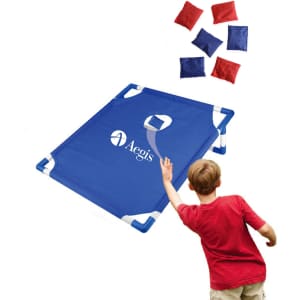 A portable blue cornhole game board with a logo and red and blue bean bags.