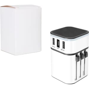 A white travel adapter with black accents, featuring multiple USB ports, beside a plain white box.