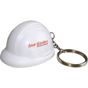 A white helmet-shaped stress reliever attached to a metal keyring, featuring a logo.