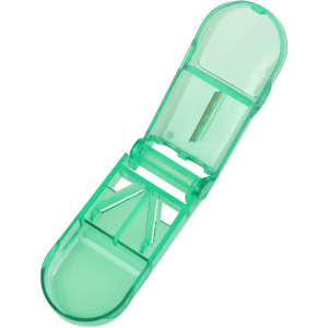 A green pill box with a cutter feature, designed for medication storage and organisation.